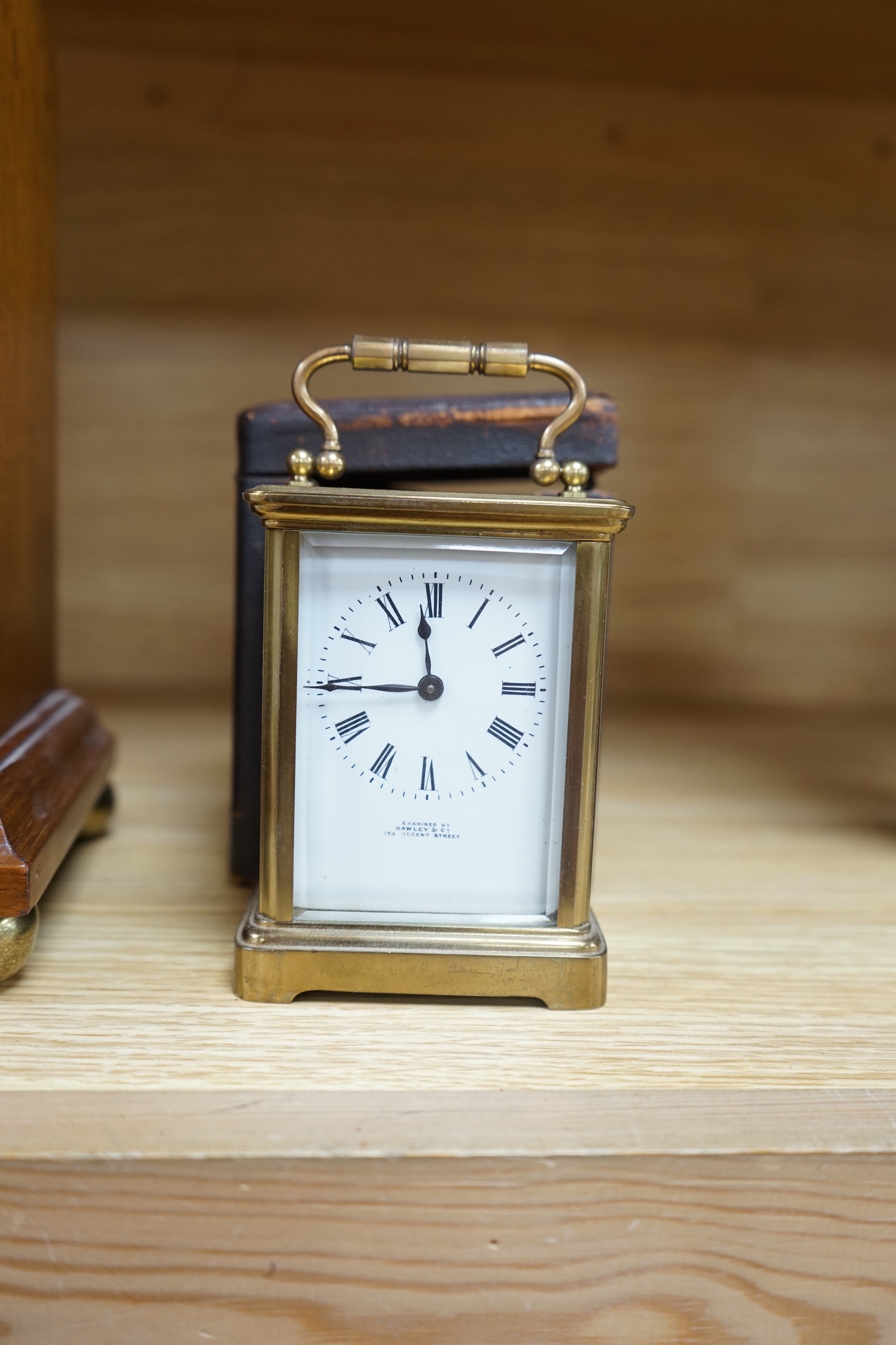 A cased brass carriage timepiece and a dome topped Edwardian mantel clock striking on a coiled gong, backplate stamped BTG, 29.5cm (2) Condition - fair to good.